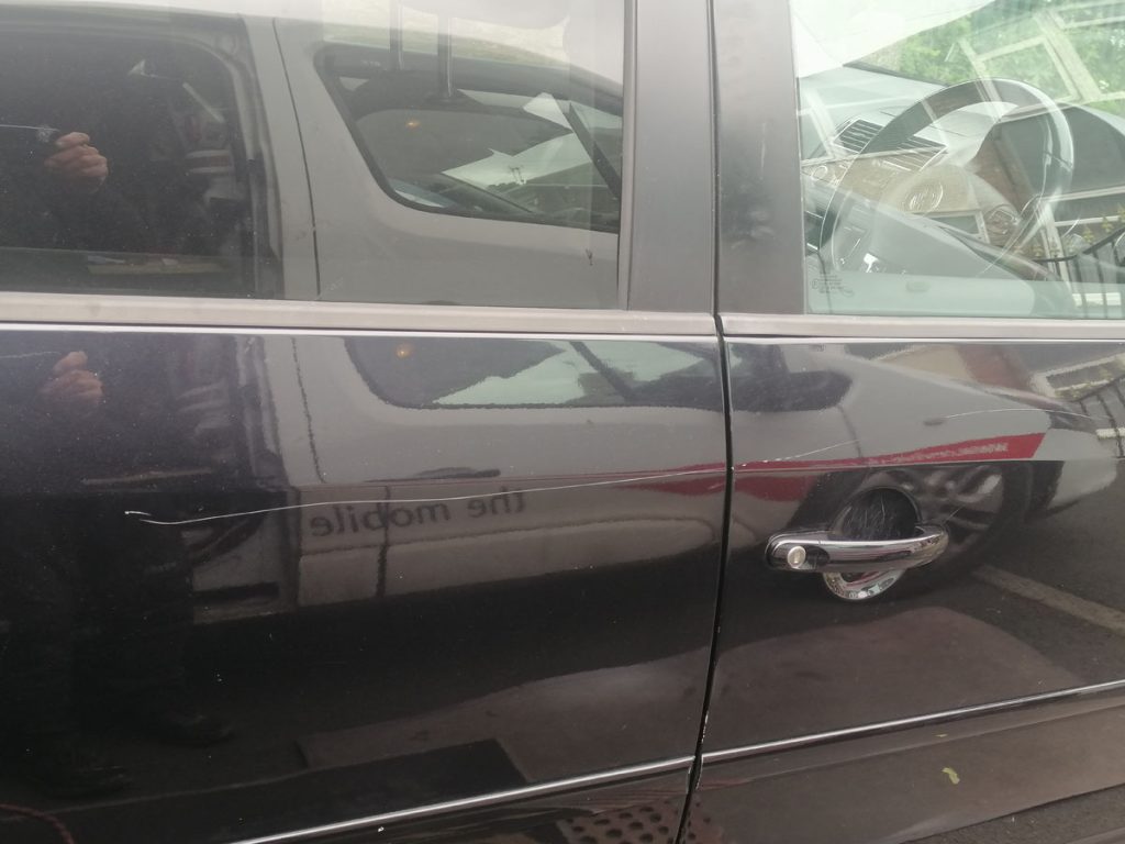 Scratched car door repair